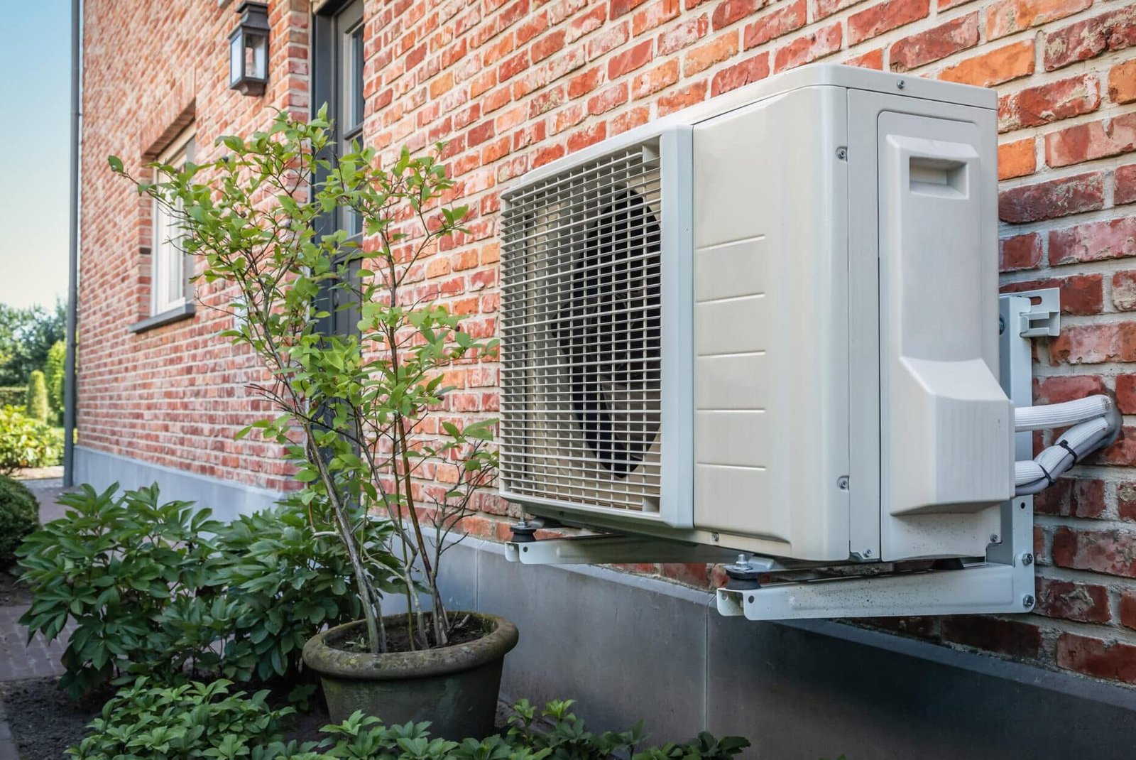 Technician installing an air conditioner unit in a California home